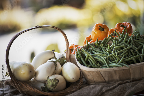 Photo: Organic Vegetable on Display; Organic White Eggplant; Green Beans; Yellow and Red Bell Peppers Organic Vegetable on Display; Organic White Eggplant; Green Beans; Yellow and Red Bell Peppers