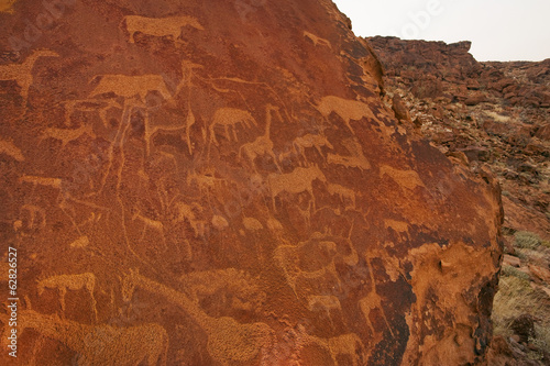 Photo: Rock art engravings at Twyfelfontein World Heritage Site at Uibasen Conservancy, Damaraland, Namibia Rock art engravings at Twyfelfontein World Heritage Site at Uibasen Conservancy, Damaraland, Namibia