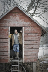Photo: An organic farm in upstate New York, in winter. A man standing in the doorway of a henhouse. An organic farm in upstate New York, in winter. A man standing in the doorway of a henhouse.