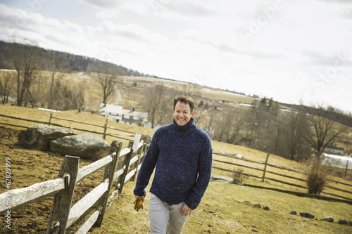 Photo: An Organic Farm in Winter in Cold Spring, New York State. A man working outdoors on the farm. An Organic Farm in Winter in Cold Spring, New York State. A man working outdoors on the farm.