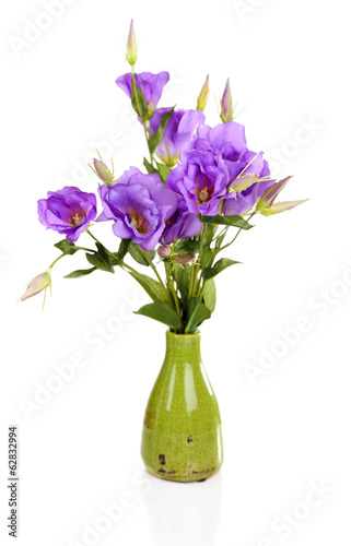 Photo: Purple artificial eustoma in vase isolated on white Purple artificial eustoma in vase isolated on white