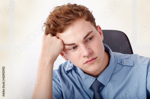 Photo: Young man while thinking Young man while thinking