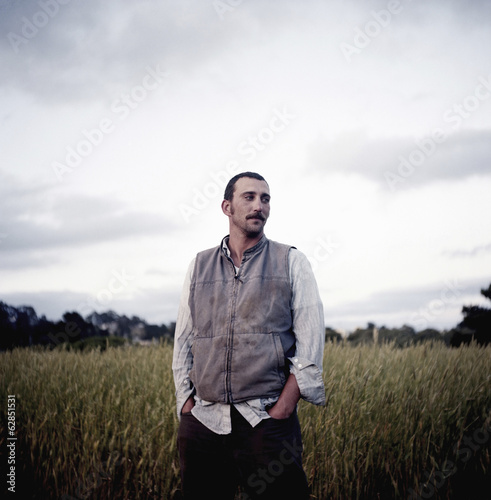 Photo: A man standing in the field at the social care and work project, the Homeless Garden Project in Santa Cruz. A man standing in the field at the social care and work project, the Homeless Garden Project in Santa Cruz.