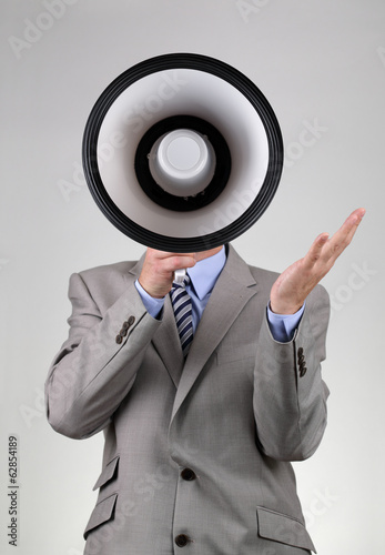 Photo: Businessman shouting through a megaphone Businessman shouting through a megaphone