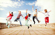 group of teenagers jumping group of teenagers jumping