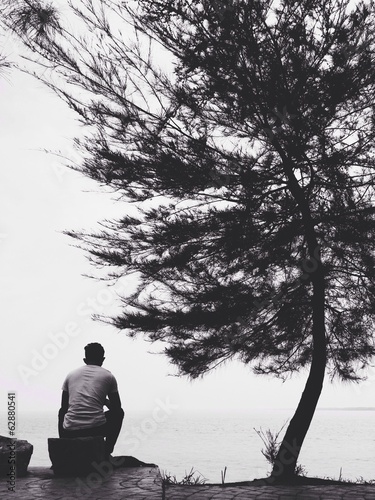 Instant Collection: man sitting on the beach man sitting on the beach