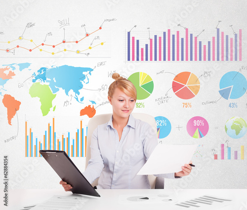 Photo: Business woman with colorful charts Business woman with colorful charts