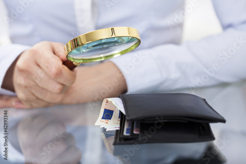 Photo: Businessperson With Magnifier And Wallet Businessperson With Magnifier And Wallet