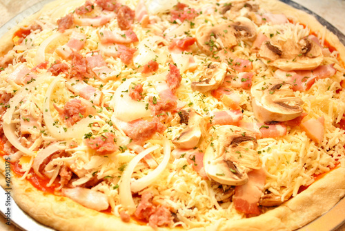Photo: Raw Pizza with Mushrooms, Bacon, Oinions and Sausage Raw Pizza with Mushrooms, Bacon, Oinions and Sausage