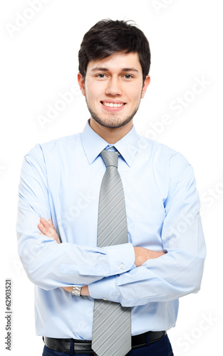 Photo: Smiling young businessman isolated on white Smiling young businessman isolated on white