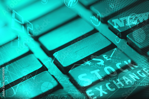 Photo: Keyboard with glowing business icons Keyboard with glowing business icons