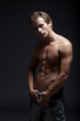 Sexy seminude blond man posing looking at camera Sexy seminude blond man posing looking at camera