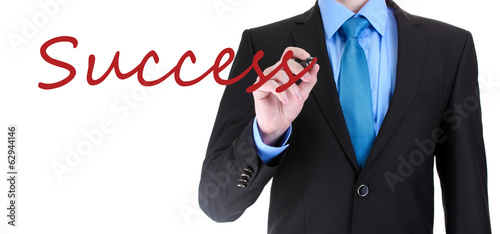 Photo: Businessman writing Success on transparent board Businessman writing Success on transparent board
