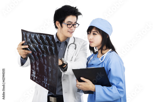 Photo: Two doctors are checking xray Two doctors are checking xray
