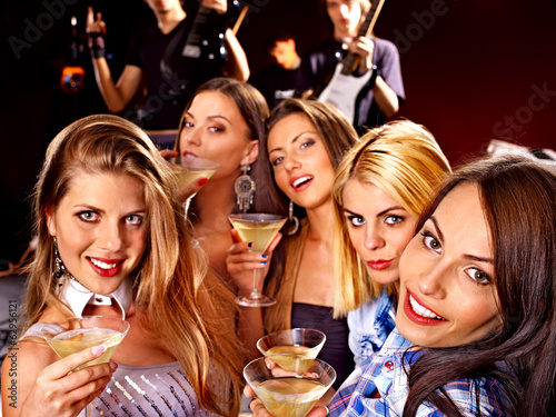 Photo: Woman on disco in night club. Woman on disco in night club.