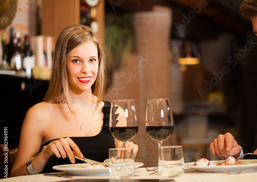 Photo: Couple eating at a restaurant Couple eating at a restaurant