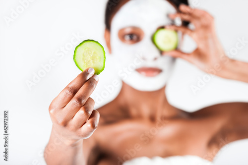 Photo: Beautiful African woman in Studio with facial mask Beautiful African woman in Studio with facial mask
