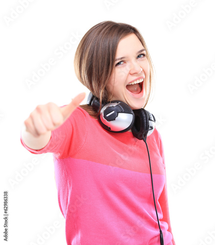 Photo: Portrait of attractive young woman showing a thumbs up Portrait of attractive young woman showing a thumbs up