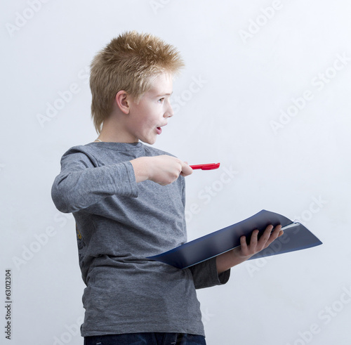 Photo: Boy proves the case of knowledge Boy proves the case of knowledge