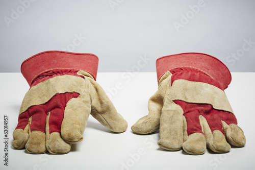 Photo: Builders protective gloves isolated on white background Builders protective gloves isolated on white background