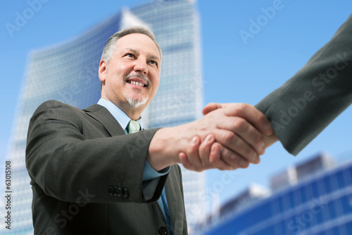 Photo: Business people shaking hands Business people shaking hands