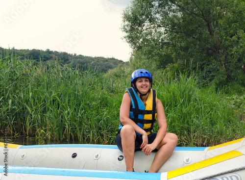 Photo: Woman going white water rafting Woman going white water rafting