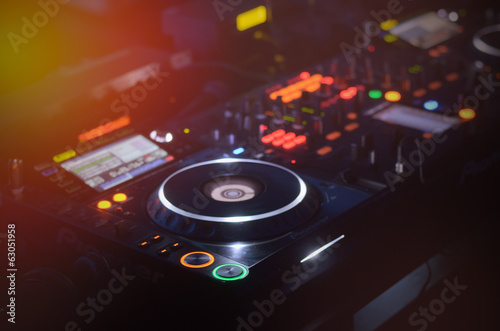 Photo: Disc Jockey mixing deck and turntables Disc Jockey mixing deck and turntables
