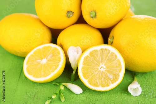 Photo: Fresh lemons and lavender on green table Fresh lemons and lavender on green table