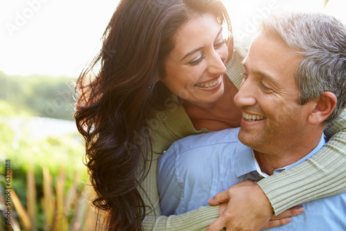 Photo: Loving Hispanic Couple In Countryside Loving Hispanic Couple In Countryside
