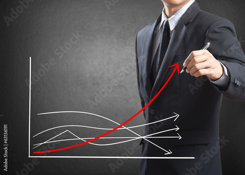 Photo: Business man drawing growth chart, Difference concept Business man drawing growth chart, Difference concept