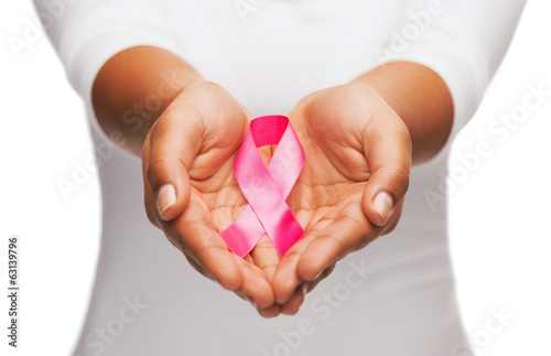 Photo: hands holding pink breast cancer awareness ribbon hands holding pink breast cancer awareness ribbon