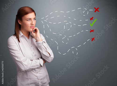 Photo: Young woman choosing between right and wrong signs Young woman choosing between right and wrong signs