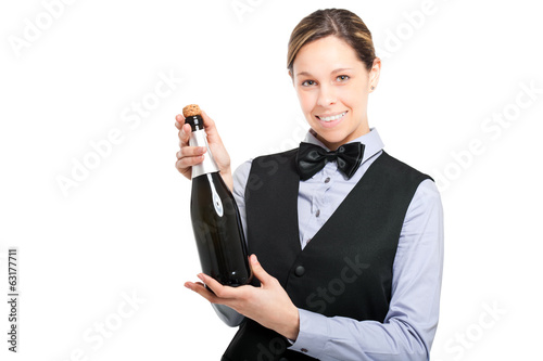 Photo: Waitress holding a bottle of champagne isolated on white Waitress holding a bottle of champagne isolated on white
