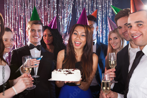 Photo: Woman Celebrating Birthday With Friends At Nightclub Woman Celebrating Birthday With Friends At Nightclub