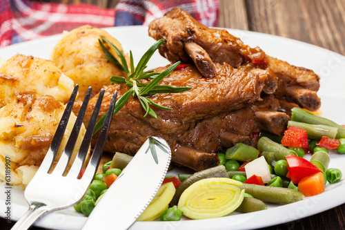 Photo: Pork spareribs served with mashed potatoes Pork spareribs served with mashed potatoes