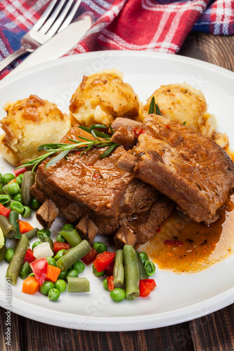 Photo: Pork spareribs served with mashed potatoes Pork spareribs served with mashed potatoes