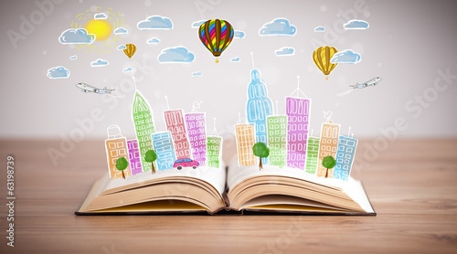 Photo: cityscape drawing on open book cityscape drawing on open book