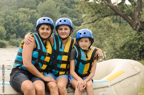 Photo: Two women and a child going rafting Two women and a child going rafting