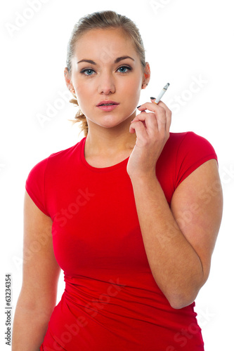 Photo: Young woman posing with cigarette Young woman posing with cigarette