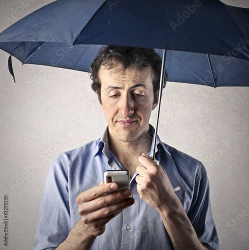 Photo: texting with umbrella texting with umbrella