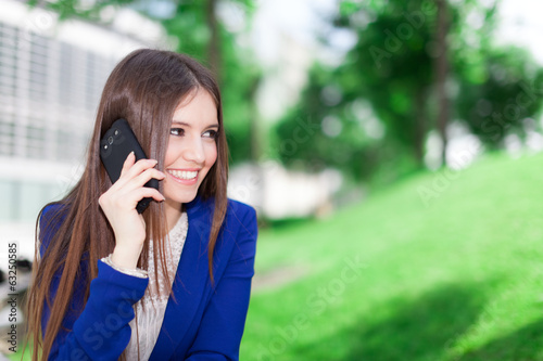 Photo: Business woman talking on the phone Business woman talking on the phone