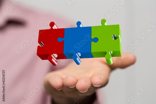 Photo: man hand puzzle solution man hand puzzle solution