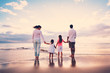 Family Having Fun on Beach at Sunset Family Having Fun on Beach at Sunset