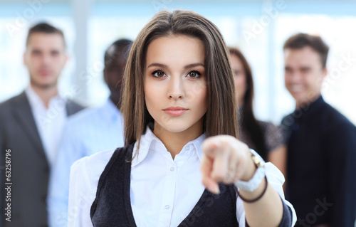 Photo: Businesswoman pointing her finger at you Businesswoman pointing her finger at you