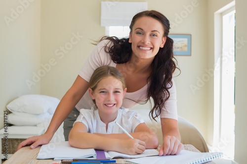 Photo: Mother and mother at studying table Mother and mother at studying table