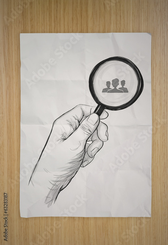 Illustration: drawing of hand holding magnifier glass looking for employee on drawing of hand holding magnifier glass looking for employee on