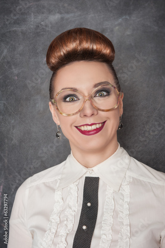 Photo: Crazy smiling woman in the eyeglasses Crazy smiling woman in the eyeglasses