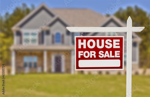 Photo: Home For Sale Sign in Front of New House Home For Sale Sign in Front of New House