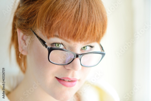 Photo: redhead girl with glasses redhead girl with glasses