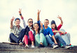 group of teenagers showing finger five group of teenagers showing finger five